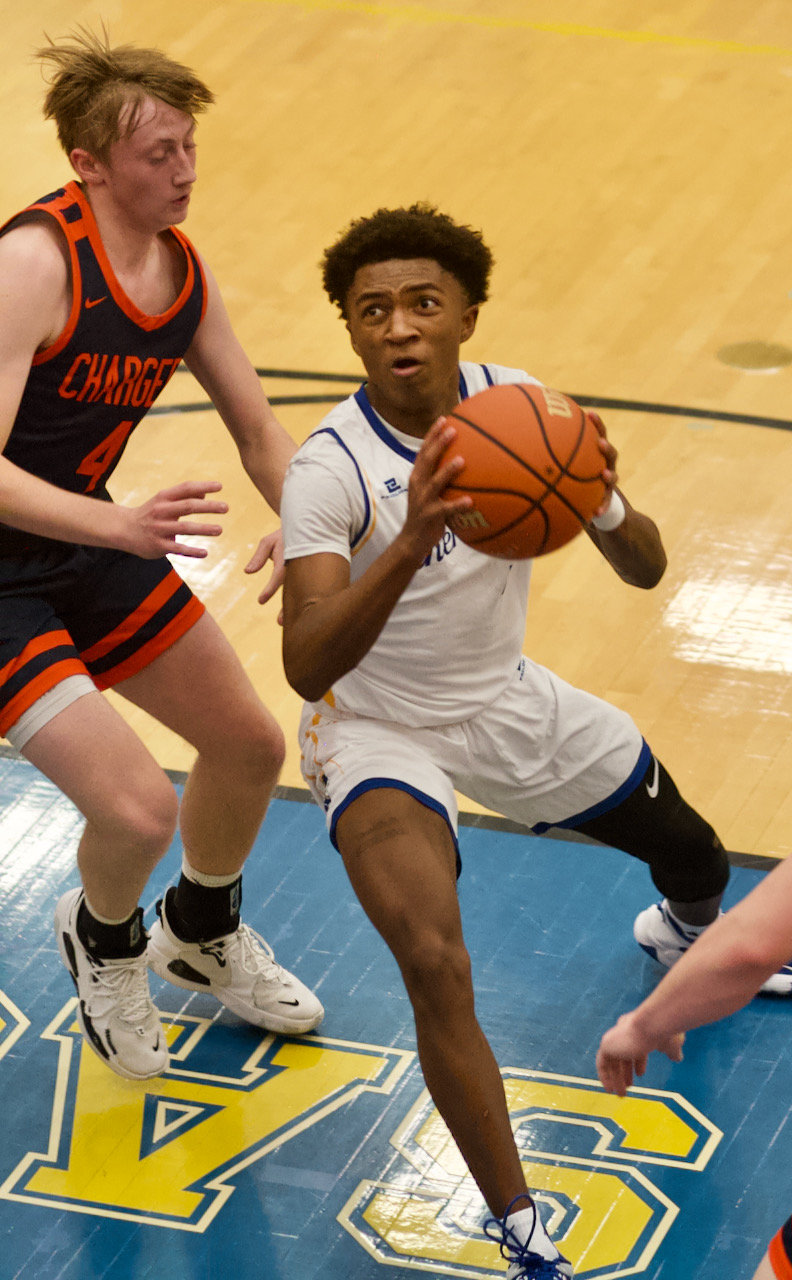 Ziair Morgan drives to bakset during Crawfordsville's 45-42 overtime thriller against county rival North Montgomery in the opening round of the Sugar Creek Classic.